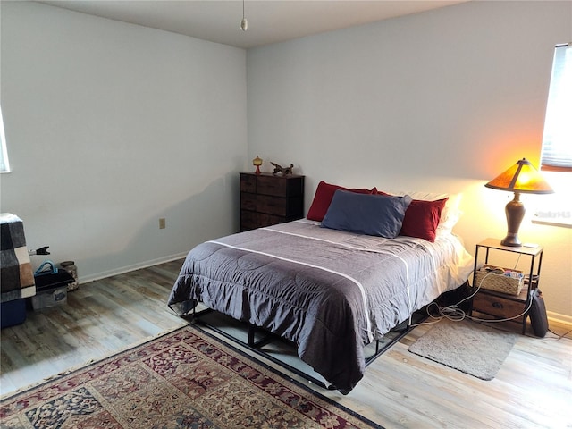 bedroom with hardwood / wood-style floors