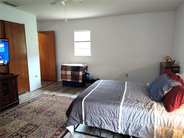 bedroom featuring ceiling fan and hardwood / wood-style flooring