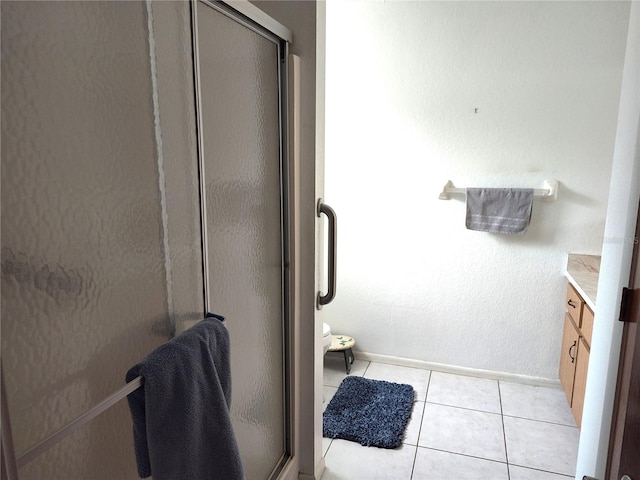 bathroom with vanity, tile patterned flooring, and an enclosed shower