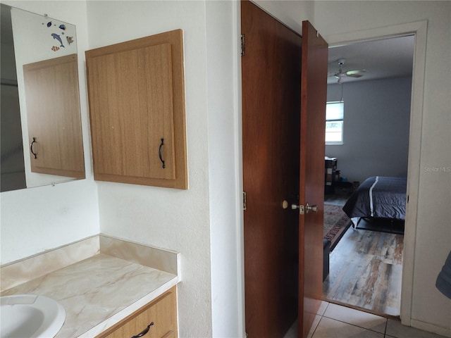 bathroom featuring vanity, tile patterned floors, and ceiling fan