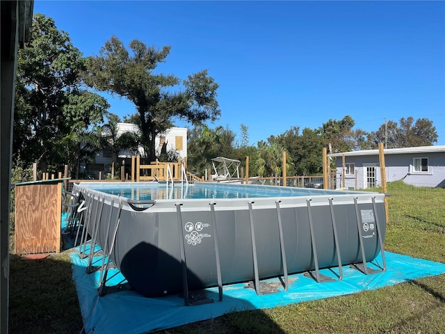 1507 Lavilla Rd, Punta Gorda, FL 33950 - outdoor pool featuring a lawn