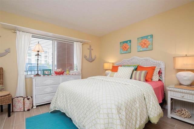 bedroom with wood-type flooring