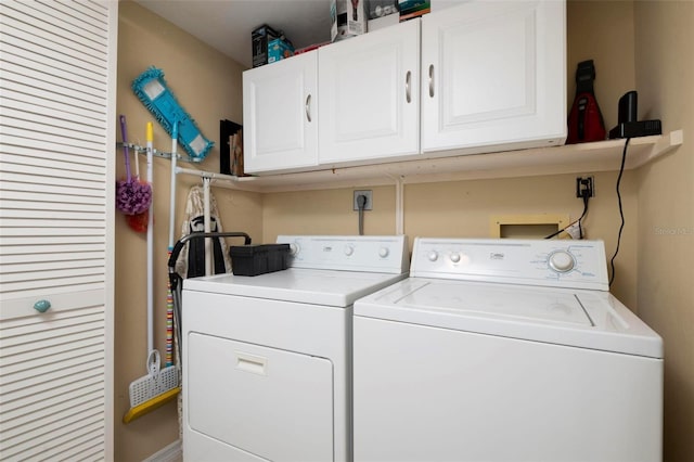 laundry area with cabinets and washer and dryer