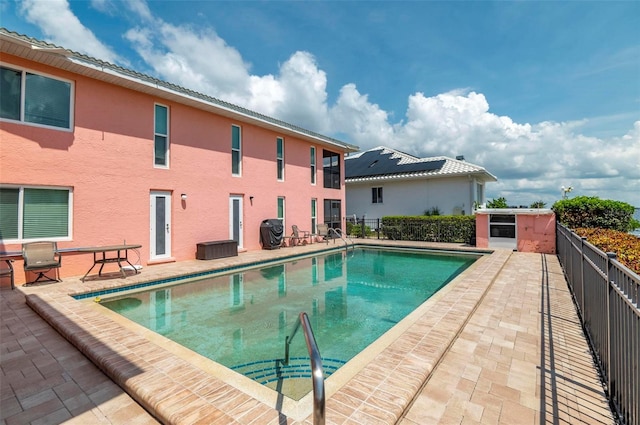 view of pool featuring a patio