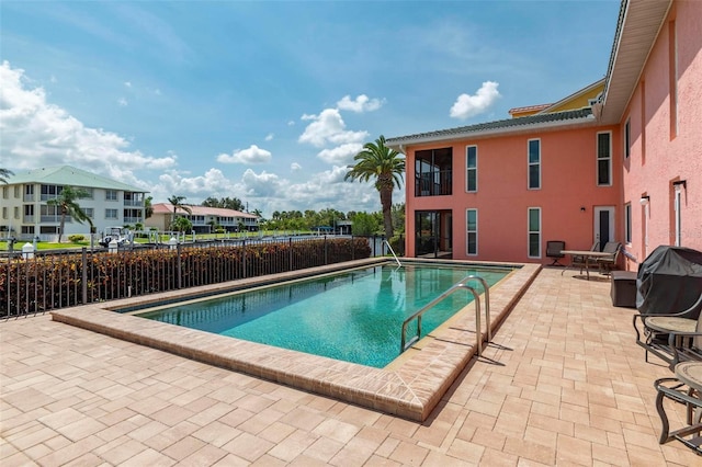 view of swimming pool featuring a patio