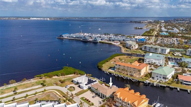 birds eye view of property featuring a water view