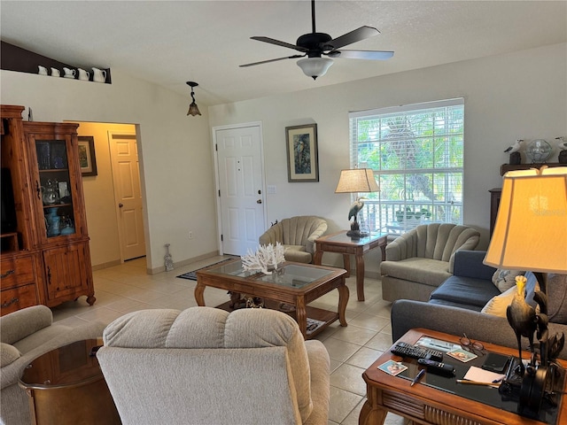 tiled living room with ceiling fan and lofted ceiling