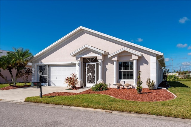 ranch-style home with a front yard and a garage