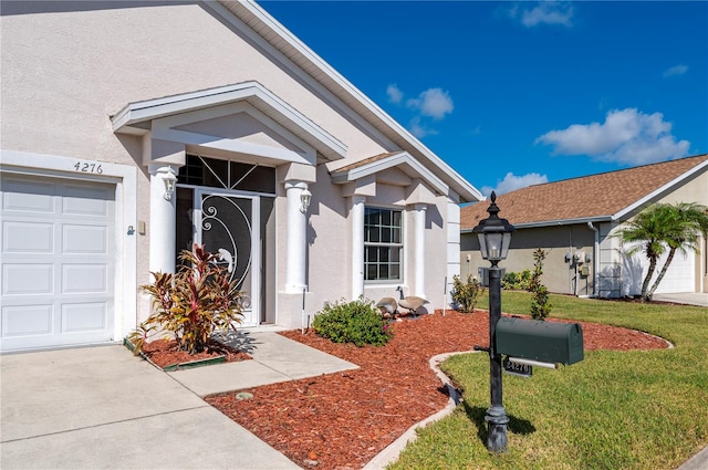 view of front facade with a front yard and a garage