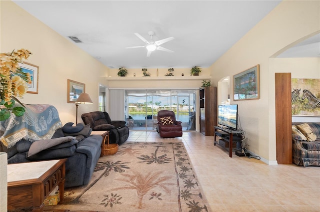 tiled living room featuring ceiling fan