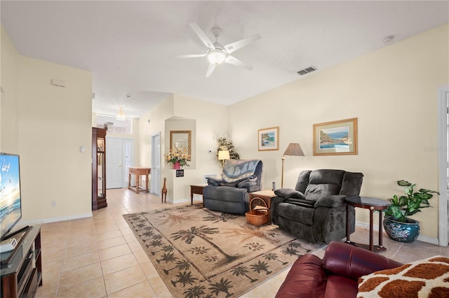 tiled living room featuring ceiling fan