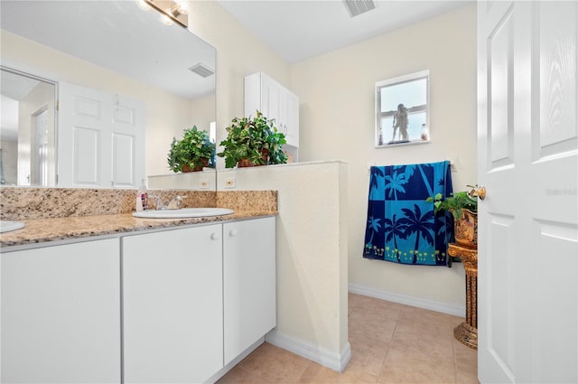 bathroom with vanity and tile patterned floors