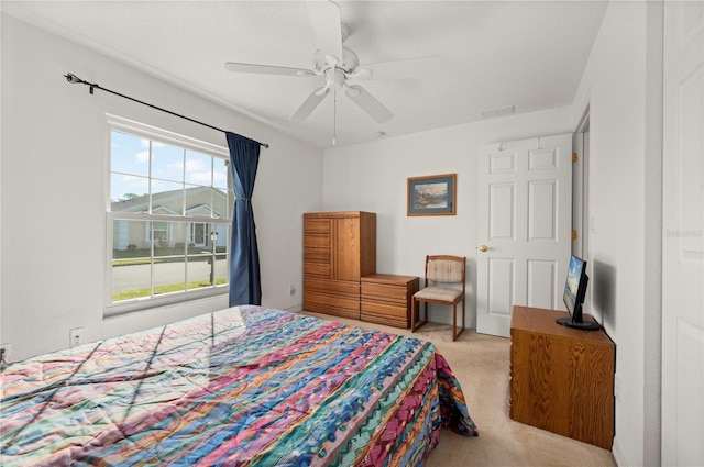 carpeted bedroom featuring ceiling fan