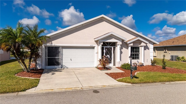 view of front of house featuring a front lawn, central AC unit, and a garage