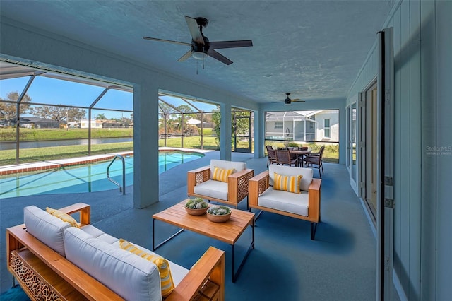 exterior space with a swimming pool, ceiling fan, and outdoor lounge area