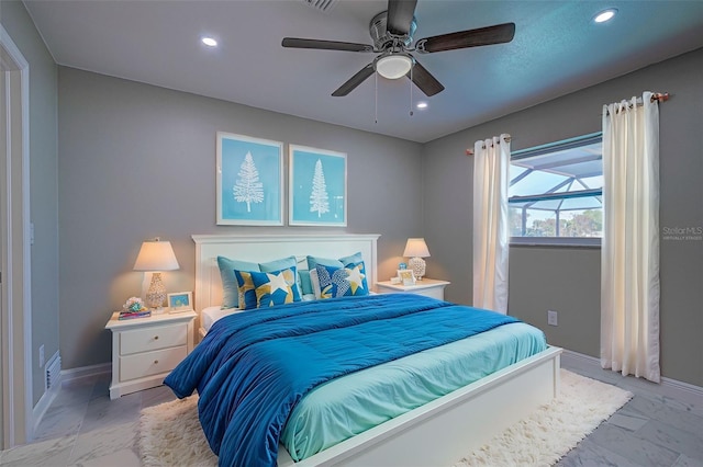 bedroom with baseboards, recessed lighting, and marble finish floor