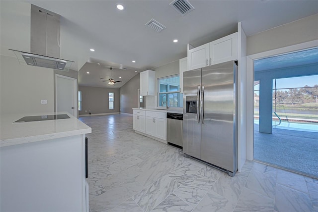 kitchen with stainless steel appliances, range hood, sink, and white cabinetry