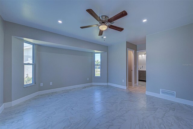 unfurnished room featuring ceiling fan