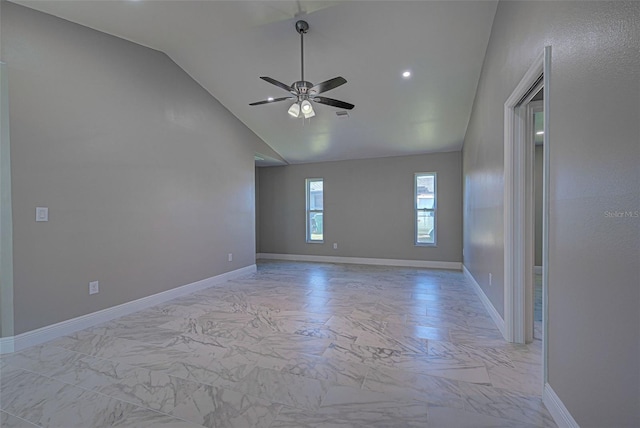 spare room with ceiling fan and lofted ceiling