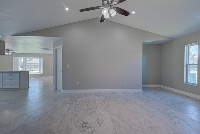 empty room with visible vents, a ceiling fan, marble finish floor, and lofted ceiling