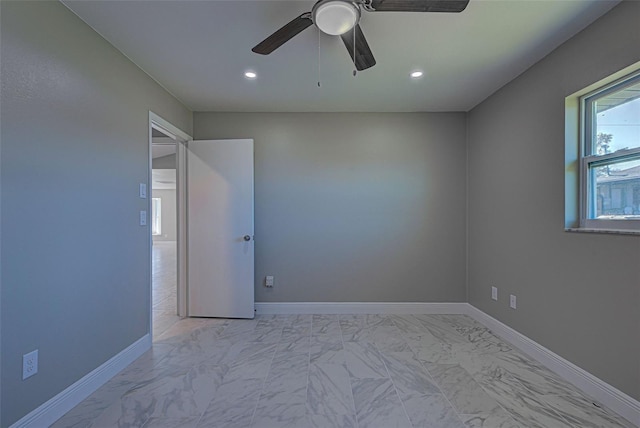 unfurnished room with ceiling fan