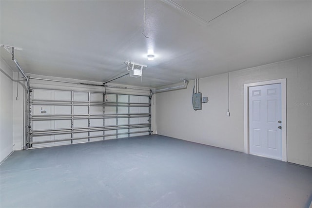 garage with electric panel and a garage door opener