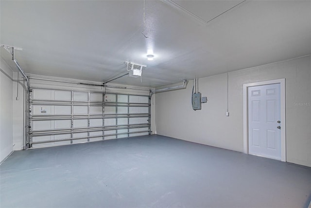 garage with a garage door opener and electric panel
