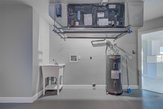 laundry area featuring water heater, baseboards, and laundry area