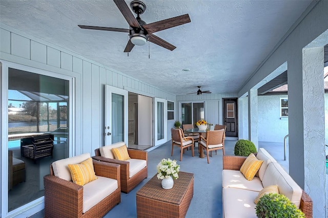 exterior space featuring ceiling fan and an outdoor hangout area