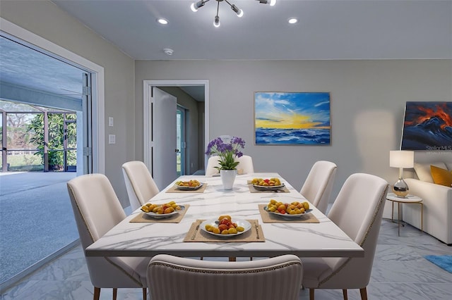 dining area with recessed lighting and marble finish floor