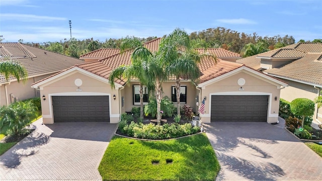 mediterranean / spanish-style house featuring a garage