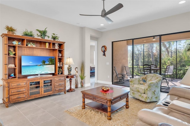 tiled living room featuring ceiling fan