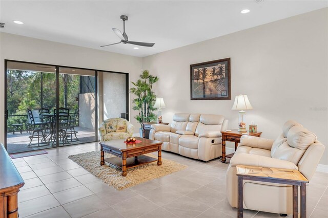 living room with light tile patterned floors and ceiling fan