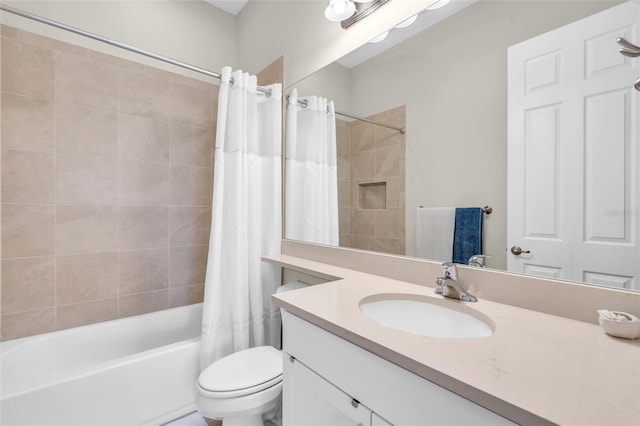 full bathroom with vanity, toilet, and shower / bath combo with shower curtain