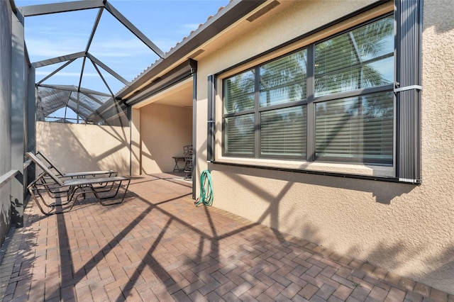 view of patio / terrace with a lanai