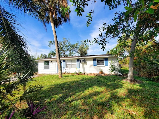 ranch-style home featuring a front yard