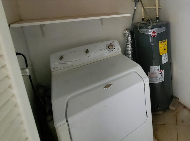 laundry area with tile patterned floors, washer / clothes dryer, and electric water heater