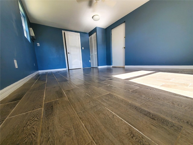 spare room featuring dark wood-type flooring