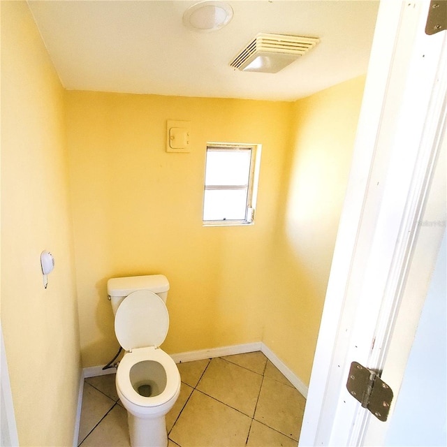 bathroom featuring tile patterned flooring and toilet