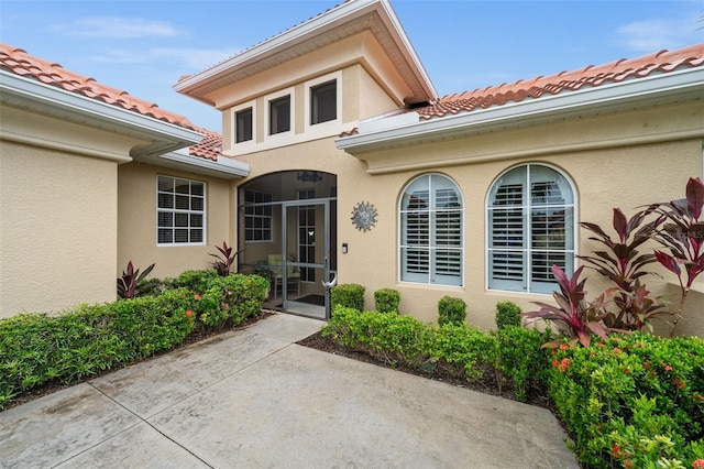 property entrance with a patio area