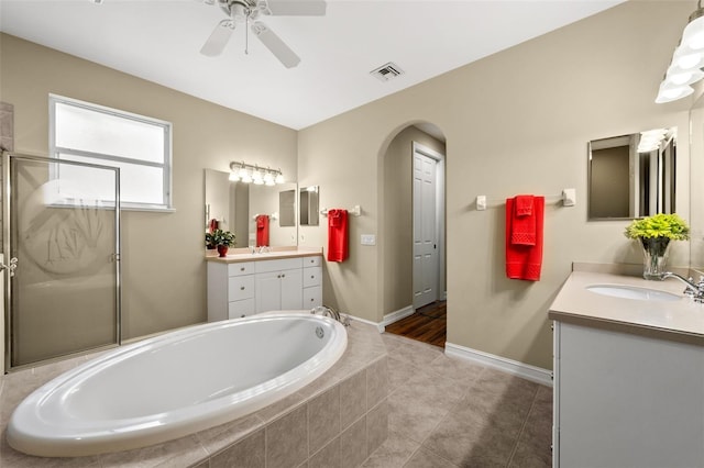 bathroom with vanity, ceiling fan, tile patterned floors, and independent shower and bath