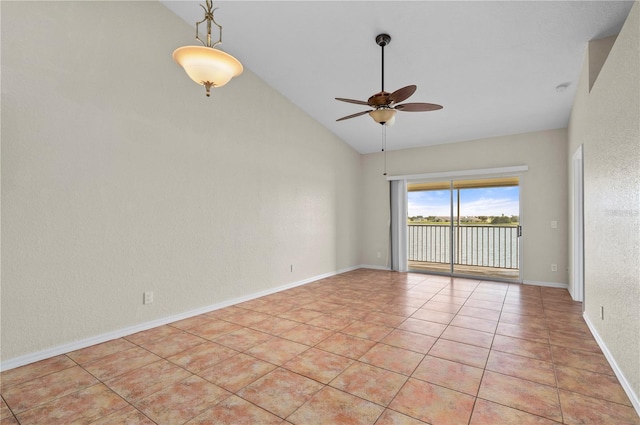 tiled spare room with ceiling fan and high vaulted ceiling