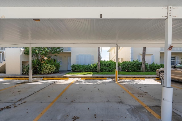 view of parking / parking lot featuring a carport