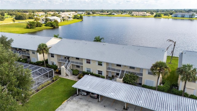 birds eye view of property with a water view