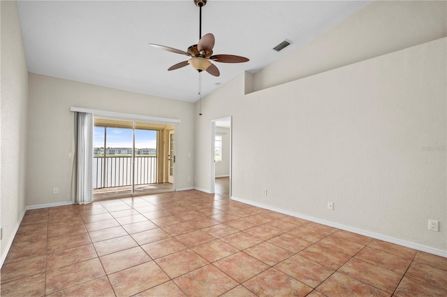 spare room with ceiling fan, light tile patterned floors, and high vaulted ceiling