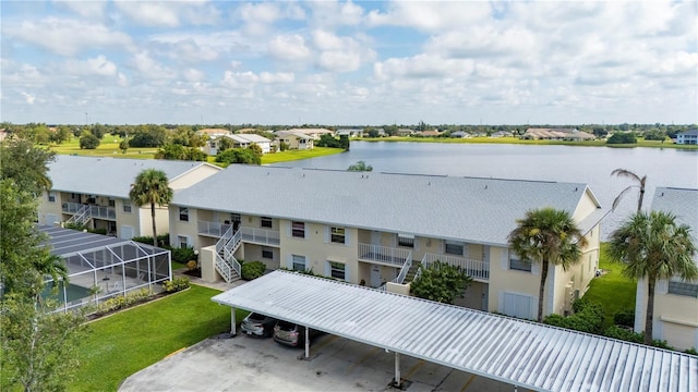 bird's eye view with a residential view and a water view