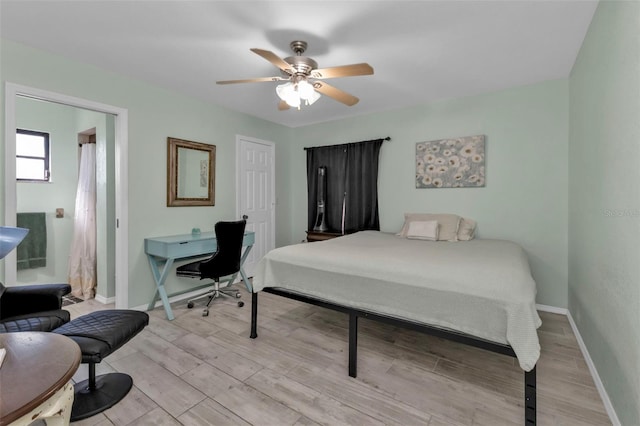 bedroom with ceiling fan and light hardwood / wood-style flooring