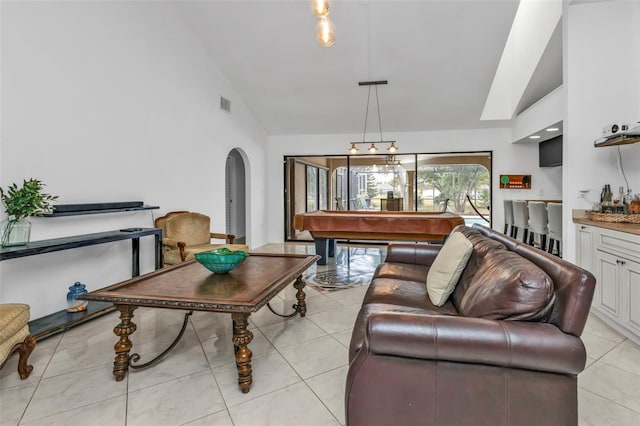 tiled living room featuring lofted ceiling and billiards