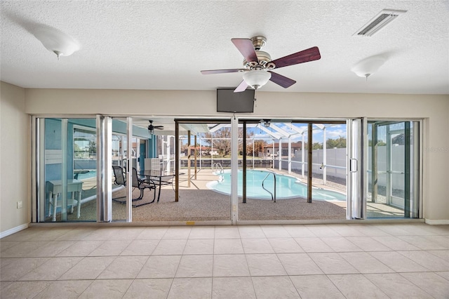 view of pool featuring ceiling fan