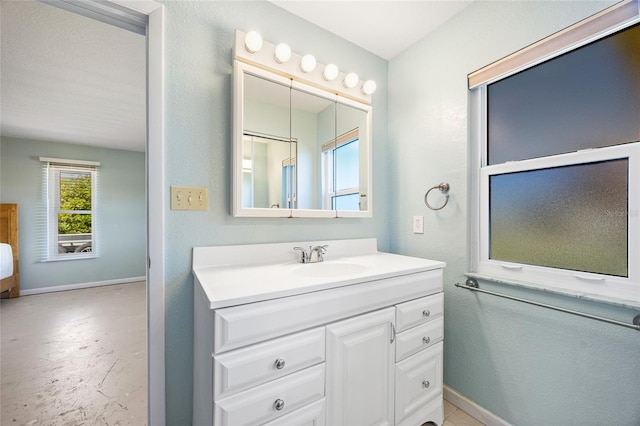 bathroom with vanity and a textured ceiling